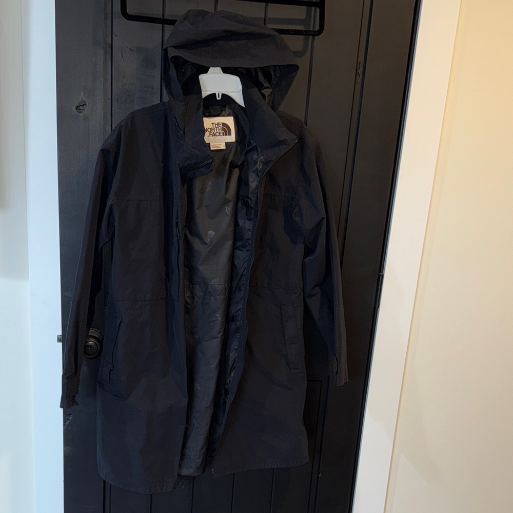 The North Face black hooded rain coat